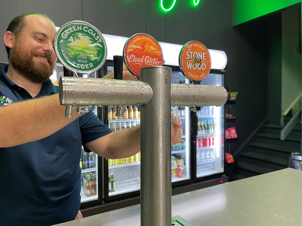 A beer being poured from the taps at the licensed bar.